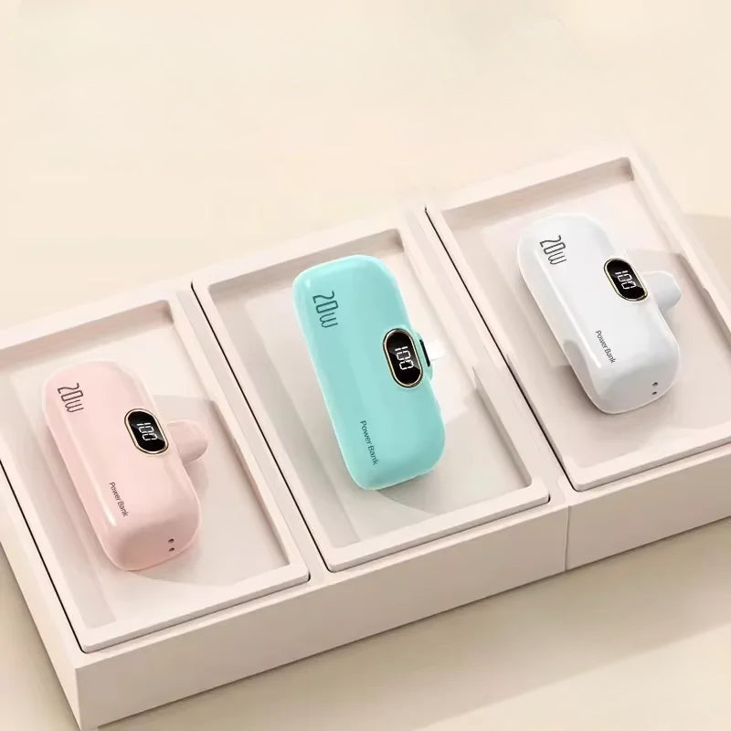 Three portable power banks in pink, blue, and white, showcasing their 20W fast charging capacity.
