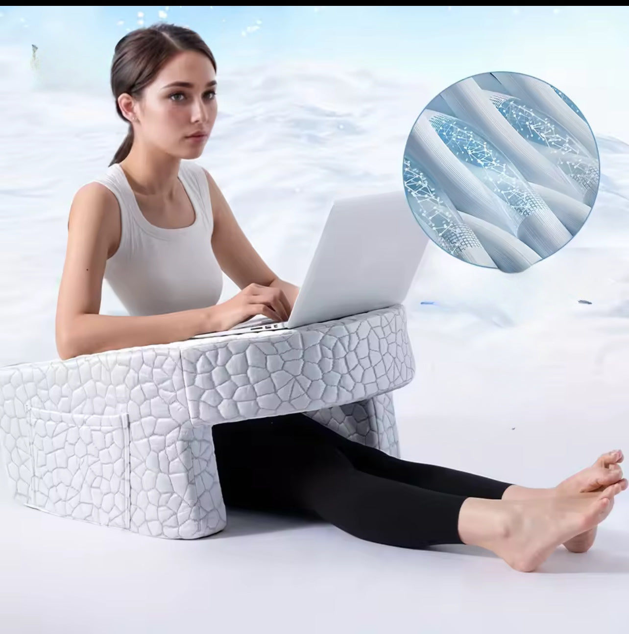 Woman using a Portable Desk Pad while working on a laptop in a comfortable seated position.